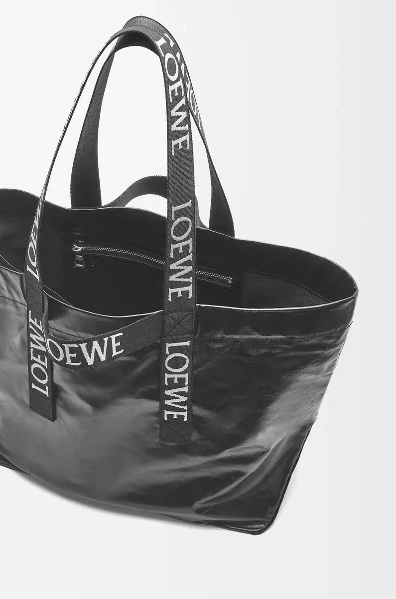 schwarze faltbare einkaufstasche aus papierkalbsleder